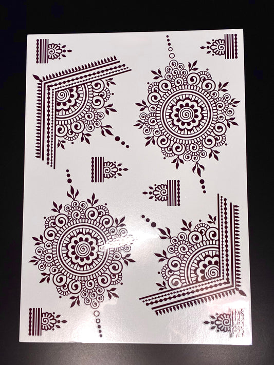 Red mandala henna transfer sheet with intricate circular mehndi designs and decorative corner patterns.