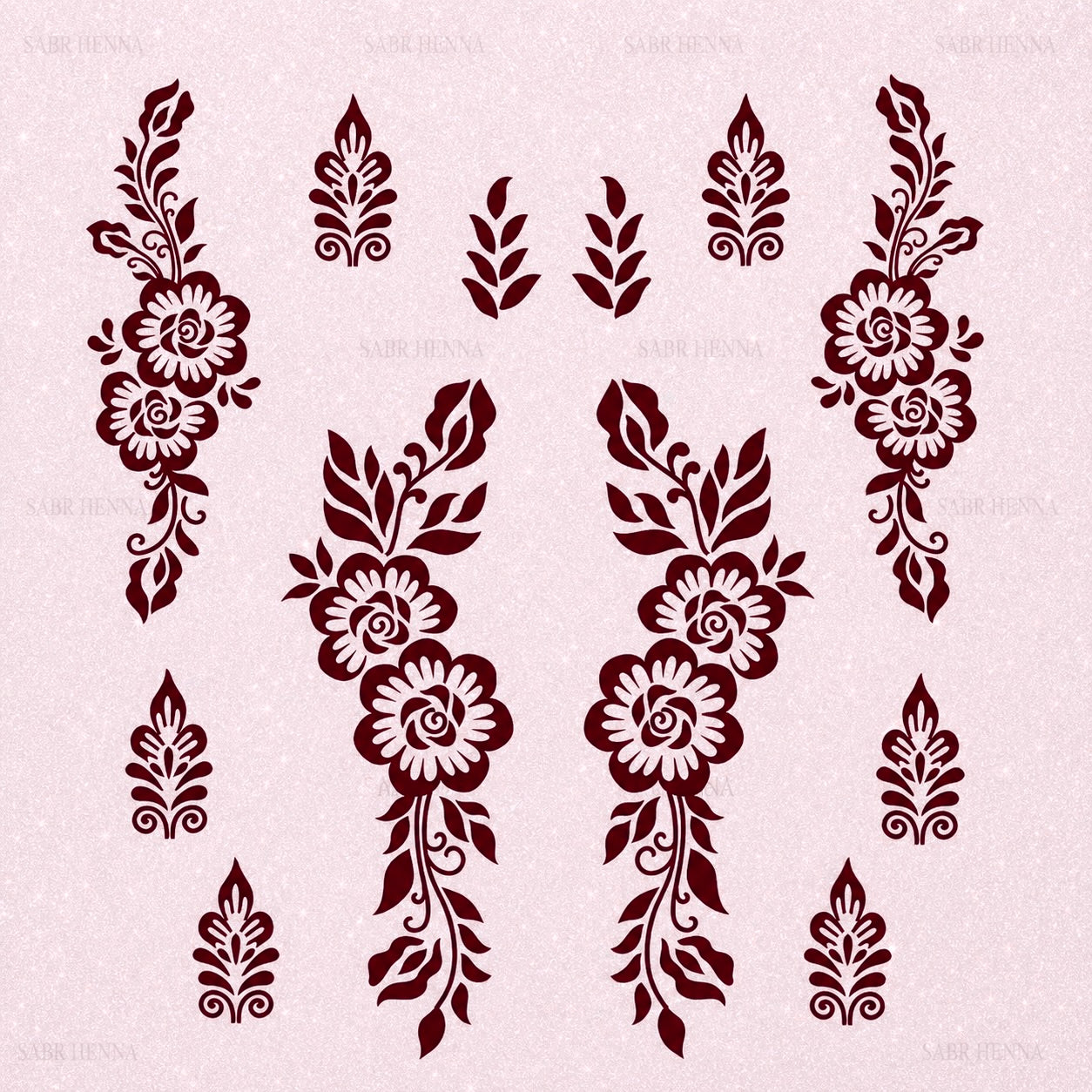 A square henna stencil sheet with a soft, light pink textured background. The sheet features multiple decorative designs arranged symmetrically. The central elements include two mirrored vertical floral patterns composed of three rose-like flowers connected by curved stems and surrounded by leaves. On the left and right sides are larger floral vine designs with similar rose and leaf elements extending vertically. Smaller motifs, including leaf clusters and ornamental teardrop-shaped patterns, are spaced.