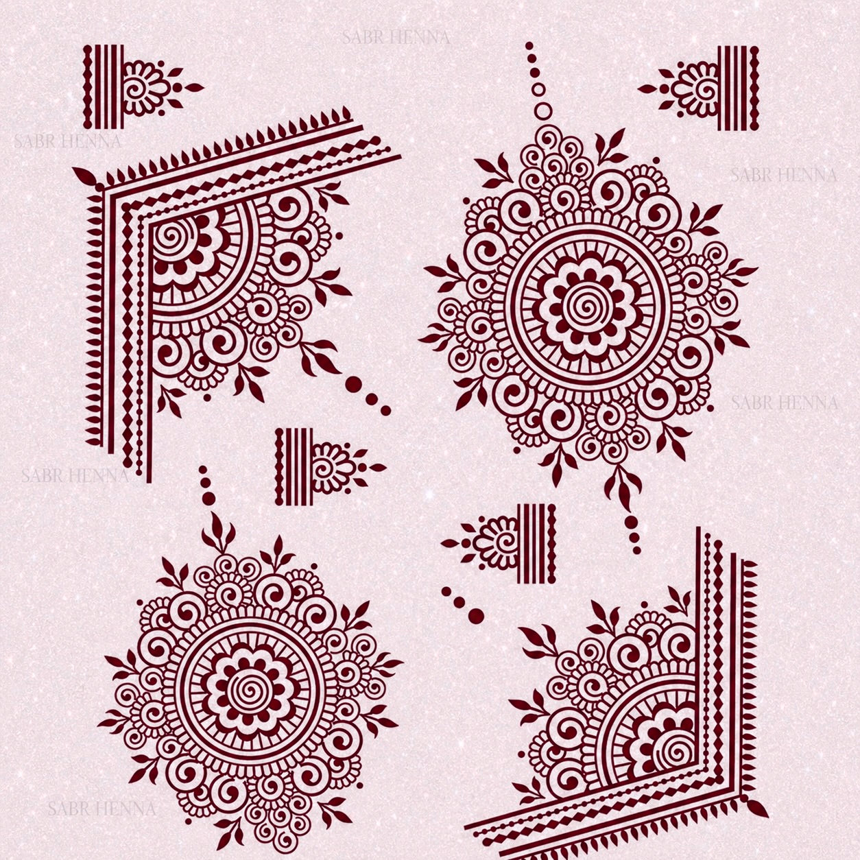 A square henna stencil sheet set against a soft, light pink textured background. The sheet displays multiple intricate designs arranged across the page. Two large circular mandala patterns feature layered petals, spiral centers, and fine line detailing, surrounded by small leaf-like accents. In opposite corners, there are large angled corner designs composed of curved floral shapes, geometric borders, and repeating line patterns. Smaller decorative elements, including short border strips, dots