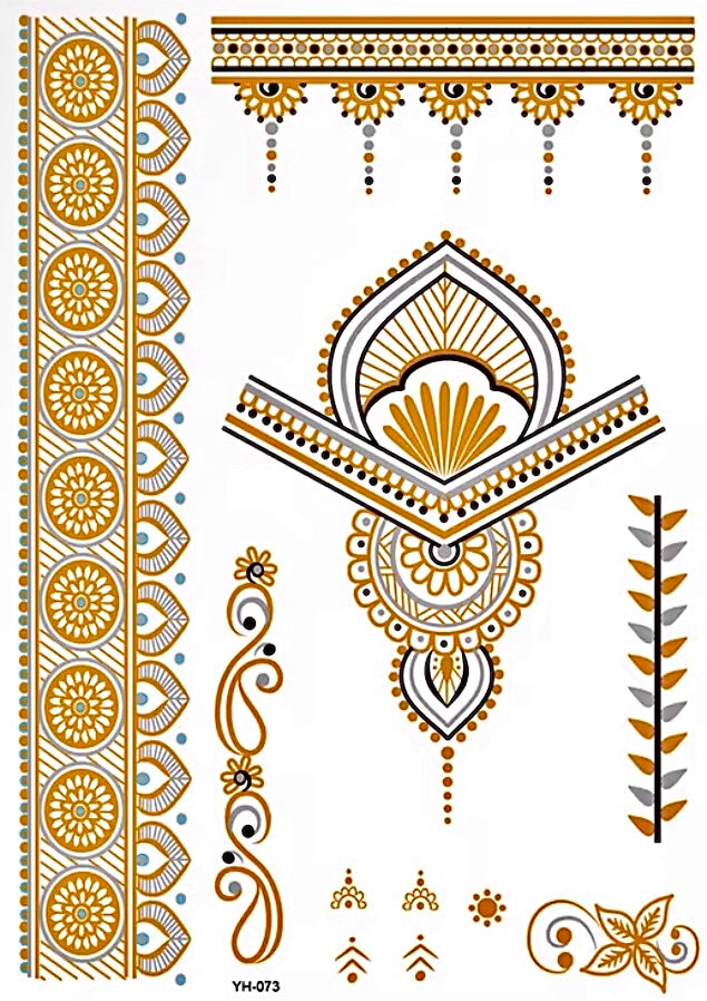 A metallic gold temporary henna tattoo sheet displayed on a computer screen against a dark background. The sheet features intricate ornamental designs including floral borders, geometric accents, hanging decorative details, and a central lotus-inspired motif in gold, black, and silver tones.